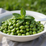 Delicious homemade spring pea salad with mint garnish, perfect for a spring picnic.