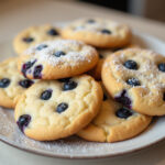 Delicious Blueberry Cheesecake Cookies with powdered sugar, ready to serve.
