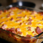 Finished Ham and Cheese Hash Brown Casserole with melted cheese, perfect for a hearty meal.