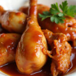 Finished Heavenly Slow Cooker Chicken Delight with shredded chicken in barbecue-apricot sauce, garnished with parsley.