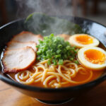 Delicious homemade ramen bowl with pork, egg, and garnishes ready to eat.