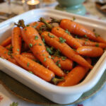 Honey roasted carrots on a serving dish, perfect for Easter dinner.