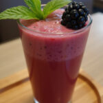 Refreshing Blackberry Hibiscus Tea Frappe garnished with blackberry and mint, ready to enjoy.