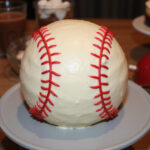 Finished Baseball Cake with red stitching detail, perfect for a sports-themed party.