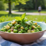 Delicious Quick Spring Pea Salad with mint garnish, perfect for a spring picnic.