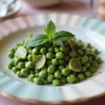 Delicious Spring Pea Salad garnished with mint, perfect centerpiece for Easter Dinner.