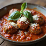 Delicious 4C bread crumb meatballs in tomato sauce with basil and Parmesan.