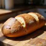 Perfectly baked batard bread, ready to slice and serve.