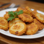 Delicious chicken bread slices garnished with parsley, ready to eat.