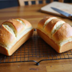Freshly baked Reka bread cooling on a rack.