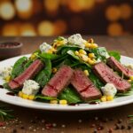 Final presentation of Balsamic Steak Gorgonzola Salad with grilled corn, highlighting the colorful and appetizing dish.