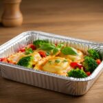 Gourmet foil-pack ravioli dinner served with vibrant vegetables, highlighting an easy and delicious meal option.