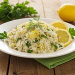 Delicious Greek Lemon Rice dish ready to serve, showcasing a vibrant plate garnished with herbs and lemon, perfect for any occasion.