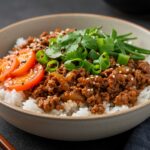 Close-up of the completed Korean Ground Beef Bowl, highlighting the colorful ingredients and inviting presentation.