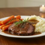 Delicious pot roast served with mashed potatoes and carrots for an easy and quick recipe presentation.