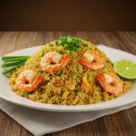 Delicious Shrimp Fried Rice served with garnishes, a vibrant and appetizing dish perfect for any meal.
