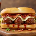 Delicious Bourbon BBQ Bacon Cheeseburger Meatball Sub on a wooden platter, highlighting the melted cheese, crispy bacon, and flavor-packed fillings, perfect for a quick 30-minute meal.