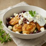 Final presentation of Easy Healthy Greek Chicken Bowls, featuring grilled chicken, vegetables, feta, and tzatziki sauce, perfect for a healthy meal.