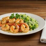 Final presentation of garlic butter shrimp and broccoli rice, a healthy and hearty meal perfect for any dining occasion.
