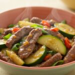 Delicious and healthy Zucchini Beef Stir-Fry presented in a bowl, emphasizing its rich colors and nutritious ingredients.